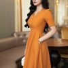 EM7095 Đầm Xoè Vàng Cổ Cách Điệu