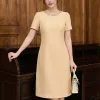 EM7434 Đầm Suông Be Hạt Cổ