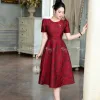 EM7517 - Đầm Xòe Gấm Taffta Vân Nổi Đỏ Đô