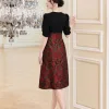 EX9770 Đầm Xoè Taffta Cam Phối Carolan Đen