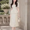 Đầm xòe công sở họa tiết bi kem EM2274